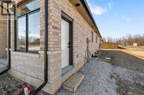 Amherstburg townhouse for rent - A house with a realtor sign on the window.