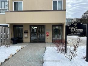 London East (East D) condo for rent - The image shows the front of a building with a sign that reads "Huron Gardens".
