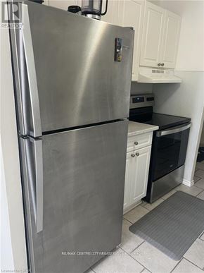 London East (East D) condo for rent - A stainless steel refrigerator in a kitchen.