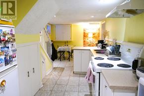 Toronto (Dovercourt-Wallace Emerson-Junction) apartment for rent - A kitchen with yellow walls and white appliances.