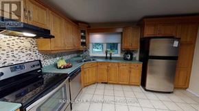 London North (North K) apartment for rent - A kitchen with wooden cabinets and a black stove top oven.