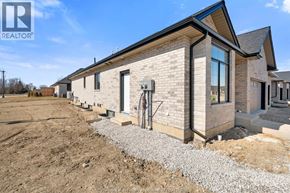 Amherstburg townhouse for rent - A house under construction with a clear sky above.