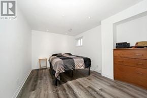 Richmond Hill (Devonsleigh) apartment for rent - A bedroom with a bed, dresser, and nightstand.