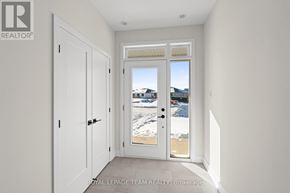 Brockville apartment for rent - A white door with a glass window is in a room with white walls.