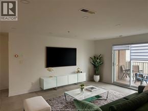 Lasalle apartment for rent - A living room with a flat screen TV mounted on the wall.