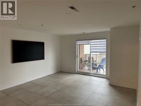Lasalle apartment for rent - A living room with a flat screen TV mounted on the wall.
