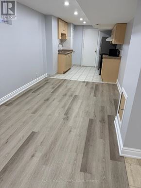 Mississauga (Churchill Meadows) apartment for rent - A room with wooden flooring and a white door.