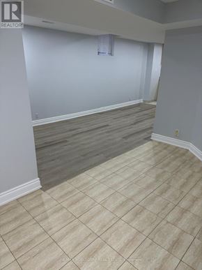 Mississauga (Churchill Meadows) apartment for rent - A room with a tile floor and a window with blinds.