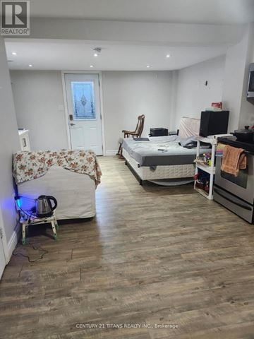 Ajax (Central) apartment for rent - A bedroom with a bed, a chair, and a sofa.