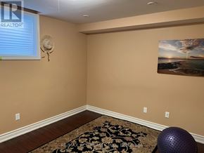 Markham (Wismer) apartment for rent - A room with a rug and a picture on the wall.