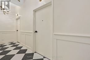 Cobourg apartment for rent - A hallway with a black and white checkered floor.