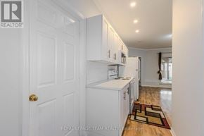 Ottawa apartment for rent - A white door with a Royal LePage Team Realty logo on it.
