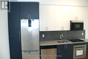 Hamilton (Kirkendall) condo for rent - A kitchen with a refrigerator, sink, and oven.