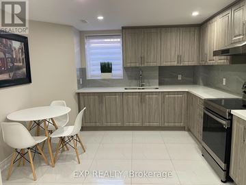 Mississauga (Meadowvale Village) apartment for rent - A kitchen with a table and chairs in front of a window.