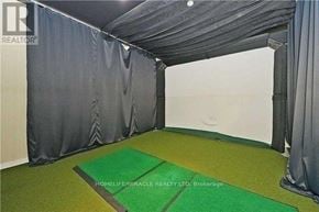 Mississauga (City Centre) condo for rent - A room with a grey curtain and a green carpet.