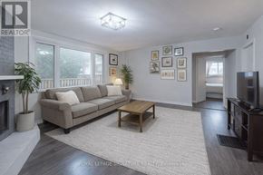 Toronto (North Riverdale) apartment for rent - A living room with a couch, coffee table, and pictures on the wall.