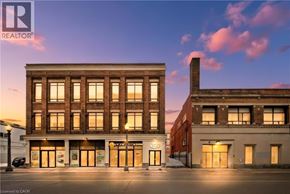 Brantford apartment for rent - A building with a sign that says REALTOR.