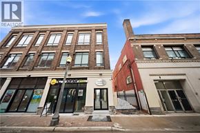 Brantford apartment for rent - A street view of a building with a sign that says "REALTOR".