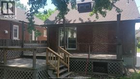 Windsor apartment for rent - A brick house with a porch and a window.