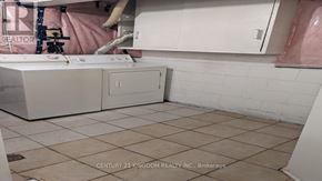 Toronto (West Hill) apartment for rent - A white washing machine and dryer in a laundry room.