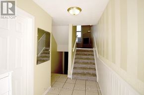 London North (North I) townhouse for rent - A hallway with a staircase leading to a landing.