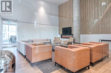 Toronto (Downsview-Roding-Cfb) condo for rent - A living room with a couch and a television.