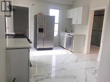 Windsor apartment for rent - A kitchen with a refrigerator, stove, and sink.