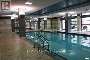 Toronto (Willowdale East) condo for rent - A pool inside a building with a REALTOR sign.