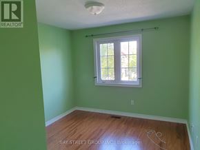 Markham (Village Green-South Unionville) apartment for rent - A room with a window and a wooden floor.