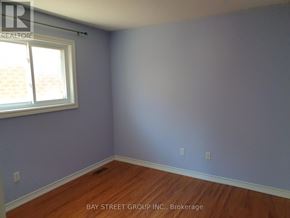 Markham (Village Green-South Unionville) apartment for rent - A room with a window and wooden flooring.