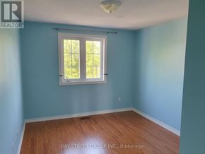 Markham (Village Green-South Unionville) apartment for rent - A room with a window and wooden flooring.