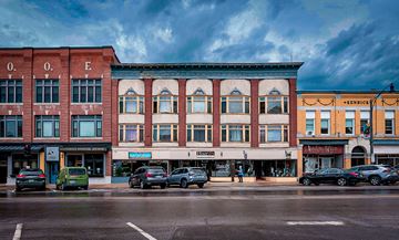 Franklin apartment for rent - A street view of a city with cars and buildings.