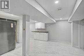 Niagara Falls (Dorchester) apartment for rent - A spacious kitchen area with white cabinets and a marble floor.