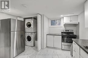 Niagara Falls (Dorchester) apartment for rent - A kitchen with a refrigerator, washing machine, and oven.