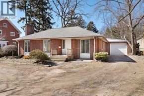 Kingsville apartment for rent - A house with a brick exterior and a white garage door is for sale.
