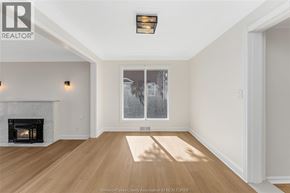 Kingsville apartment for rent - A spacious room with a fireplace and a large window.
