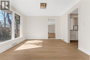 Kingsville apartment for rent - A room with a large window and a door leading to another room.