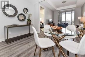 Hamilton (Central) condo for rent - A modern dining room with a glass table and white chairs.
