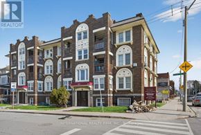 Hamilton (Stipley) multi-family for rent - A street view of a multi-story building with a sign for International Realty Firm, INC. on the bottom.