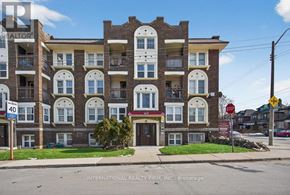 Hamilton (Stipley) multi-family for rent - A building with the sign "INTERNATIONAL REALTY FIRM, INC., Brokerage" in front of it.