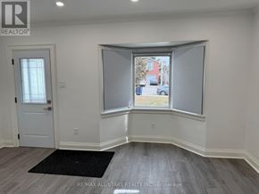 Toronto (Long Branch) apartment for rent - A room with a window and a door.
