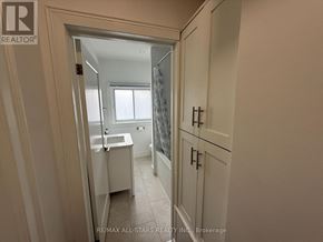 Toronto (Long Branch) apartment for rent - A bathroom with a toilet, sink, and shower.