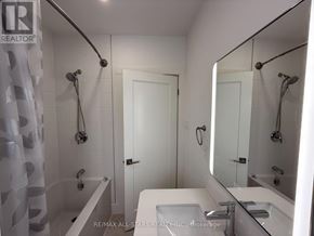 Toronto (Long Branch) apartment for rent - A white bathroom with a shower and sink.