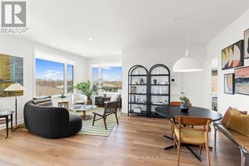 Ottawa condo for rent - A modern living room with a black bean bag chair and a glass cabinet.