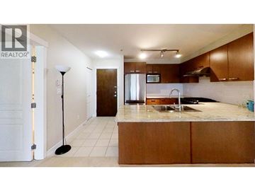 Richmond apartment for rent - A kitchen with a sink and a microwave.