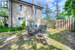 Cambridge apartment for rent - A patio with a table and chairs is in front of a house.