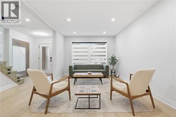 Hamilton apartment for rent - A living room with a sofa, two chairs and a coffee table.