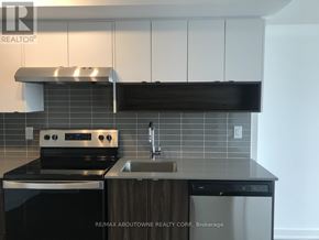 Burlington (Lasalle) condo for rent - A modern kitchen with a stove top oven and a dishwasher.