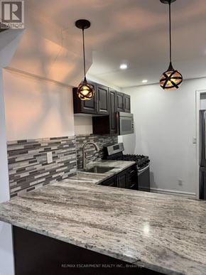 Hamilton (Crown Point) apartment for rent - A modern kitchen with granite countertops and pendant lights.