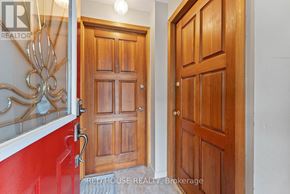 Toronto (Greenwood-Coxwell) duplex for rent - A room with a wooden floor and a white door.